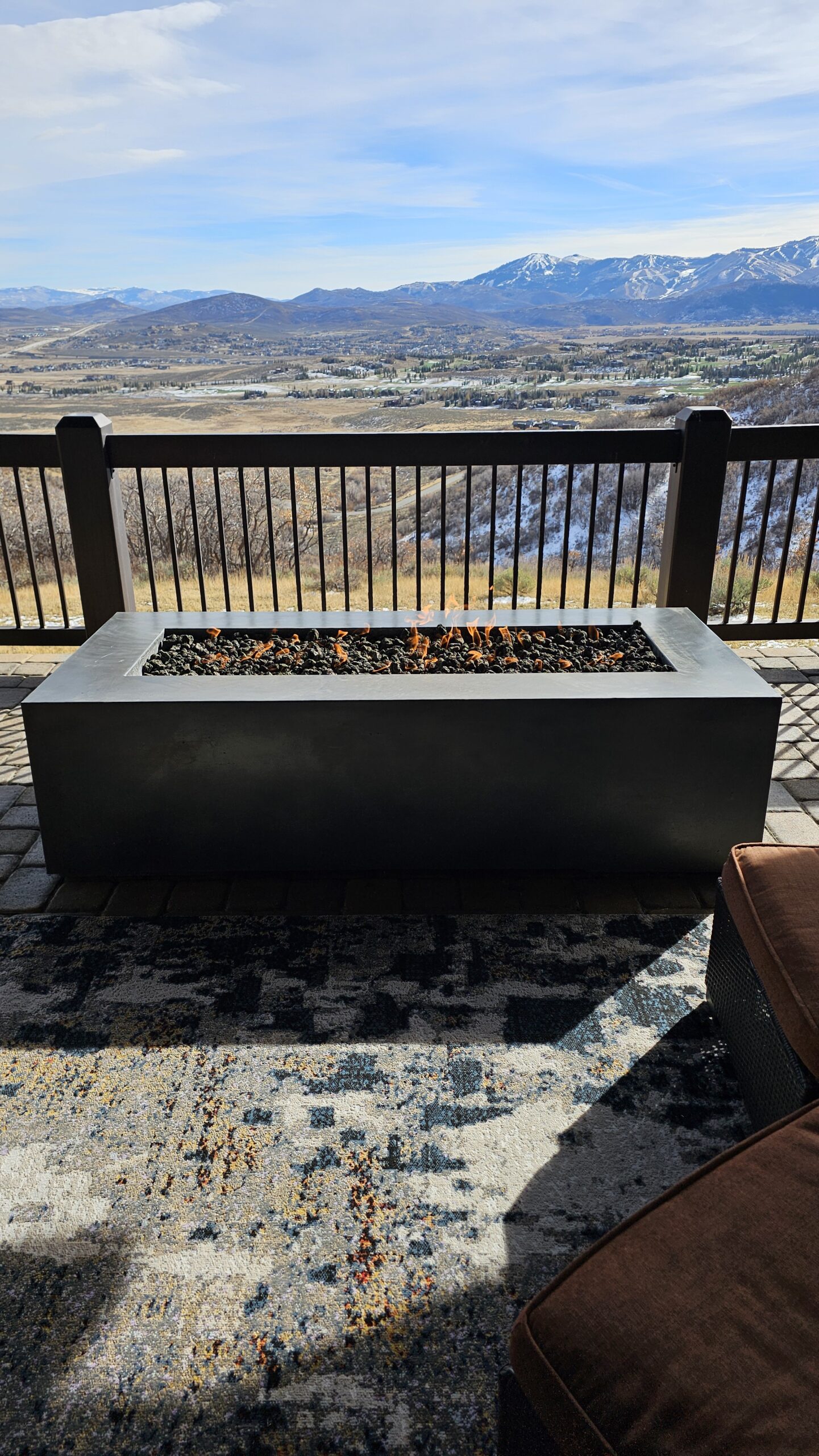 Concrete fire pit at dusk on a Salt Lake City patio